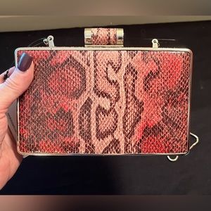 Sondra Roberts rectangle, pink snakeskin bag with Crossbody strap. Brand née